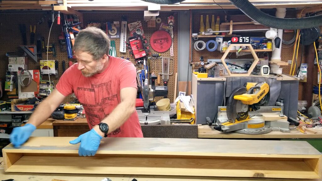 spreading weathered oak stain on the mantel